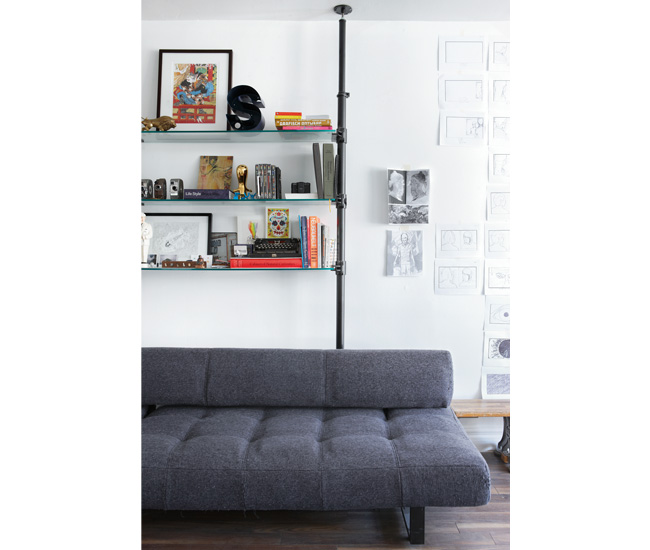 A Stronghold shelving unit displays some of Gregorio’s collections. Sofa from DesignRepublic.