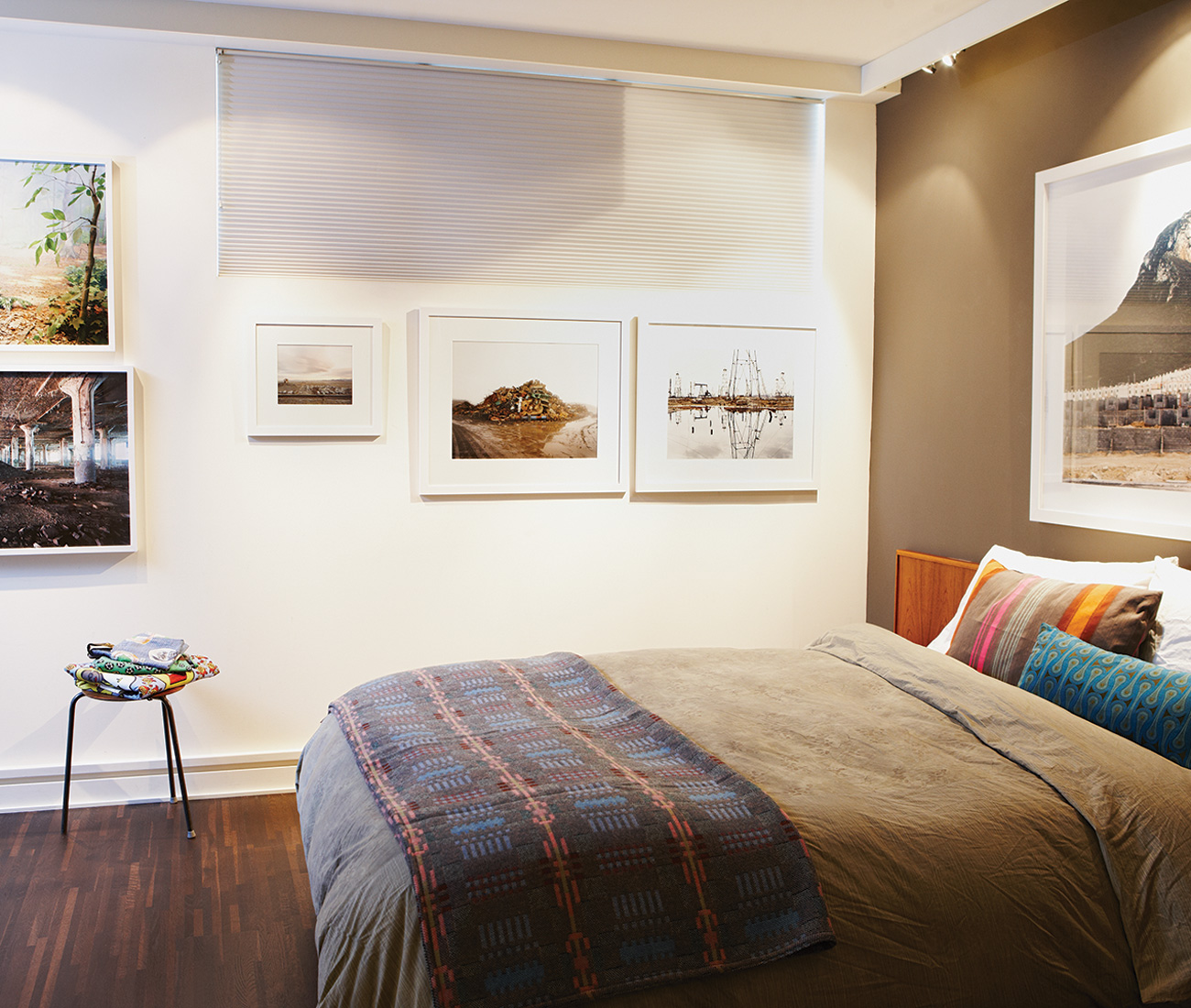 Photos by Corine Vermeulen-Smith and Edward Burtynsky, among others, hang in the master bedroom. Photo by Naomi Finlay.