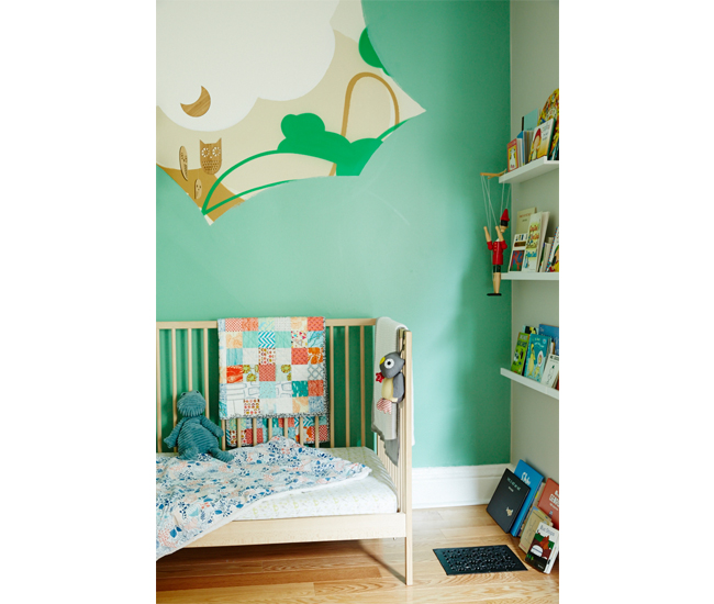 Toddler Sebastien Rabbit’s bedroom features a mural by Paquette and picture rails filled with favourite books.