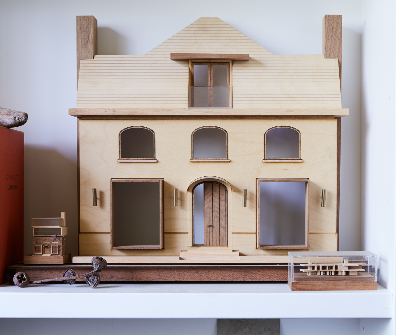 A maquette for a real-estate firm’s office they jazzed up with mahogany- and zinc-lined windows.
