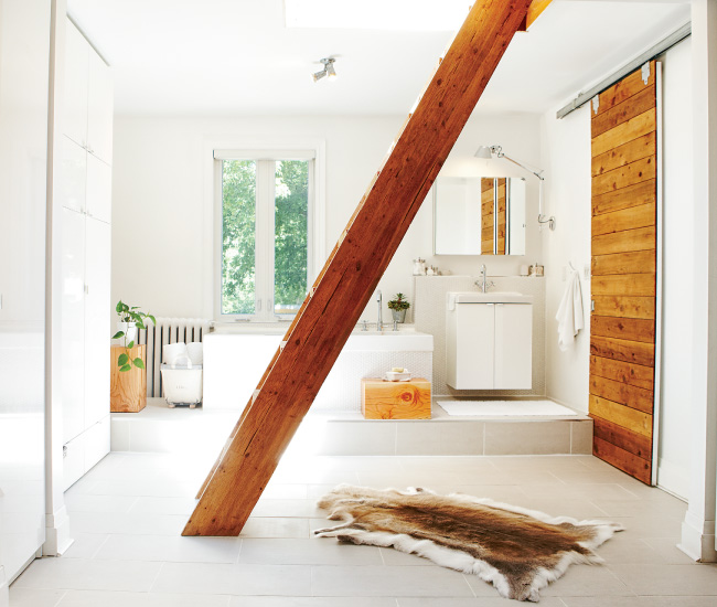 A pocket door in the master bathroom hides a water closet while the ladder leads to a rooftop patio.