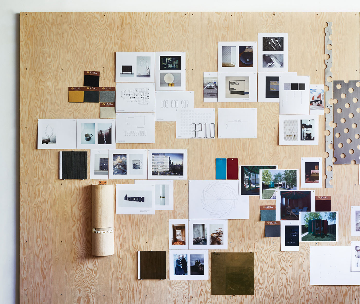 A giant mood board collects avant-garde inspiration, renderings for on-the-go projects, and material samples.