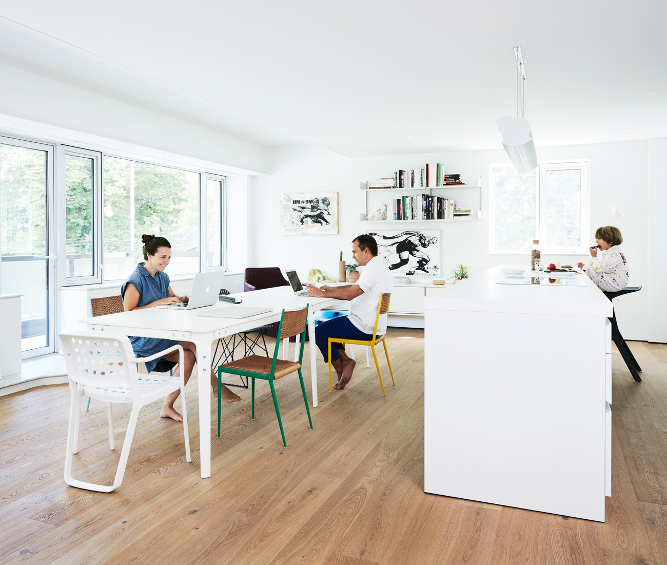 The open plan kitchen/dining space doubles as studio and family room. Flooring by Moncer; b1 kitchen system by Bulthaup; Magis table and red Vitra armchair available at Quasi Modo. Photo by Naomi Finlay.