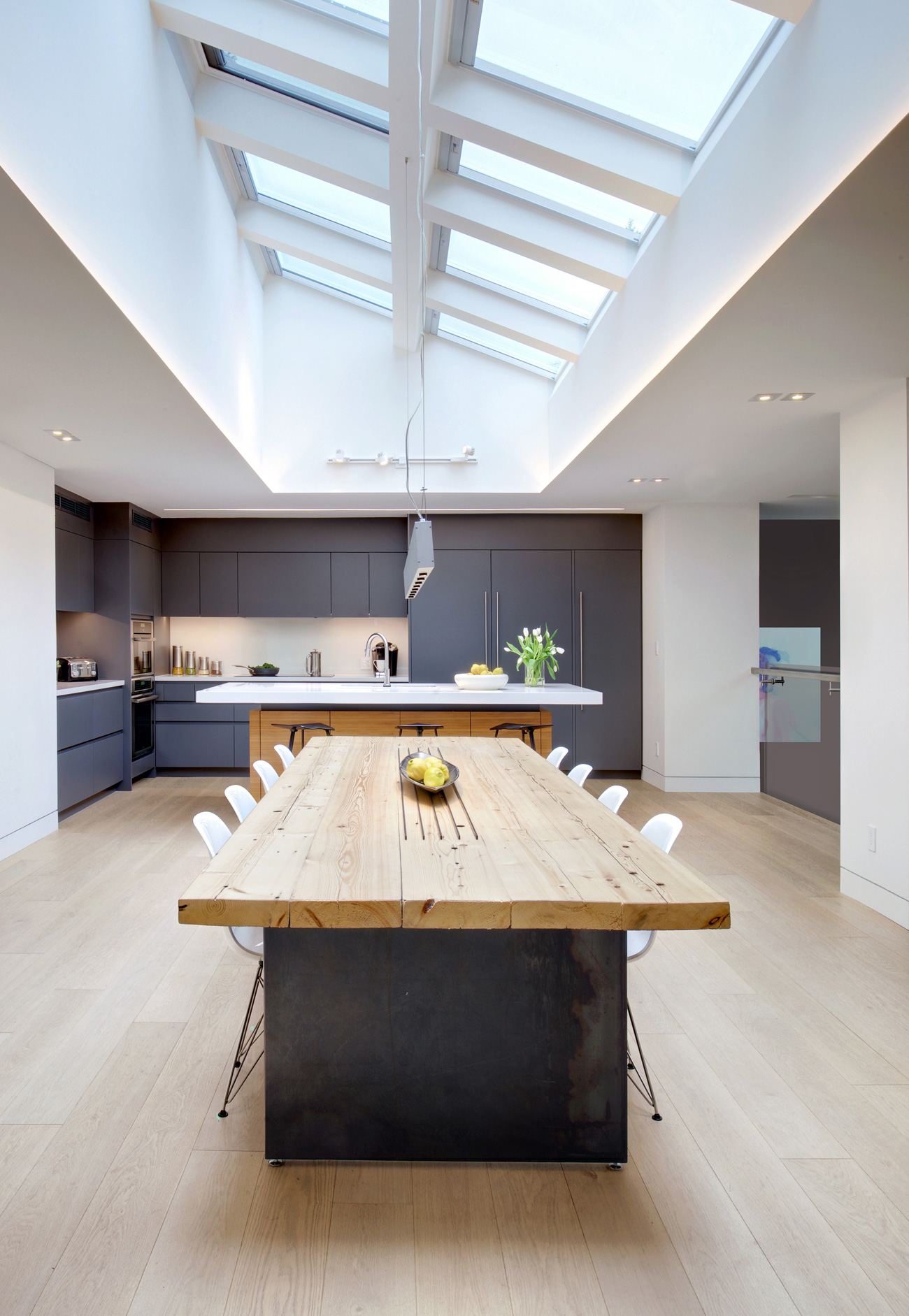 Skylights by Velux brighten the kitchen that overlooks the stage. Table and millwork by Luis Dos Santos Sousa.