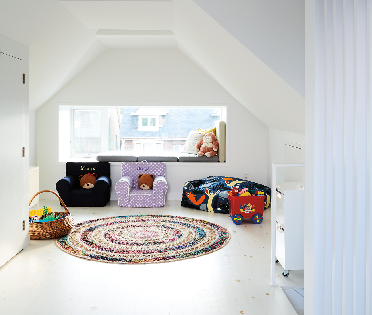 Once multiple rooms, the third floor is now home to a playroom with access to the rooftop deck. Beanbag chair from EQ3; rug from CB2. 