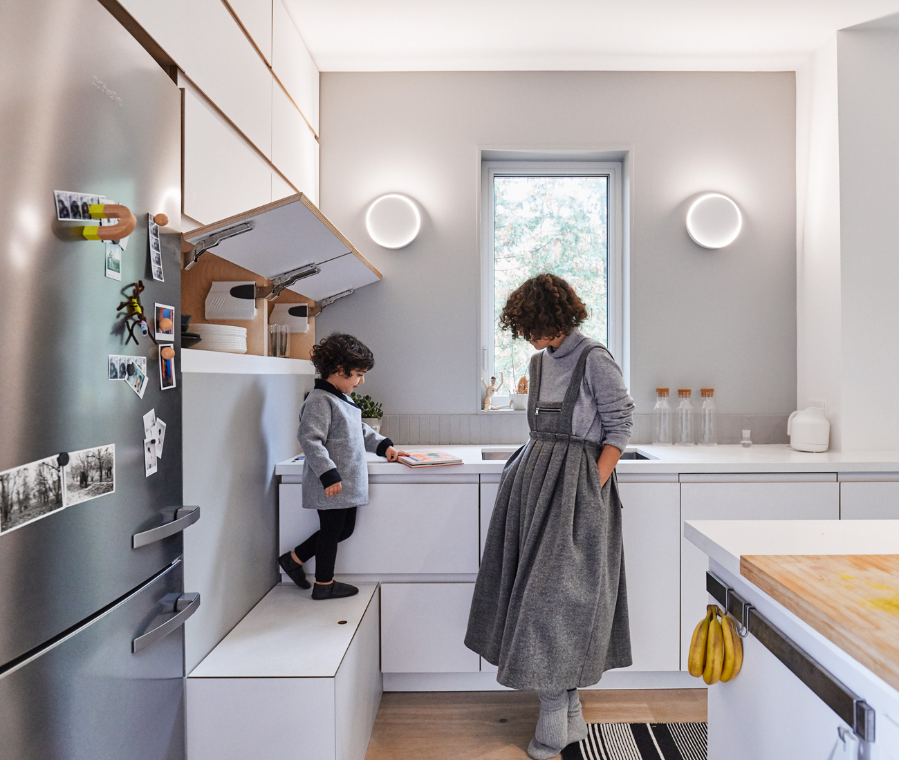 Designed by Saadatpajouh, of Space Animator, and fabricated by Ryan Wilding and Robin Clarke, the kitchen features pure white quartz countertops from Caesarstone and plywood cabinets. Lights by Toronto’s Anony; fridge by Miele.