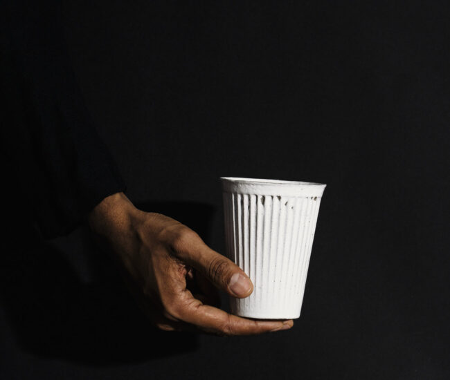 Hand with a cup of coffee