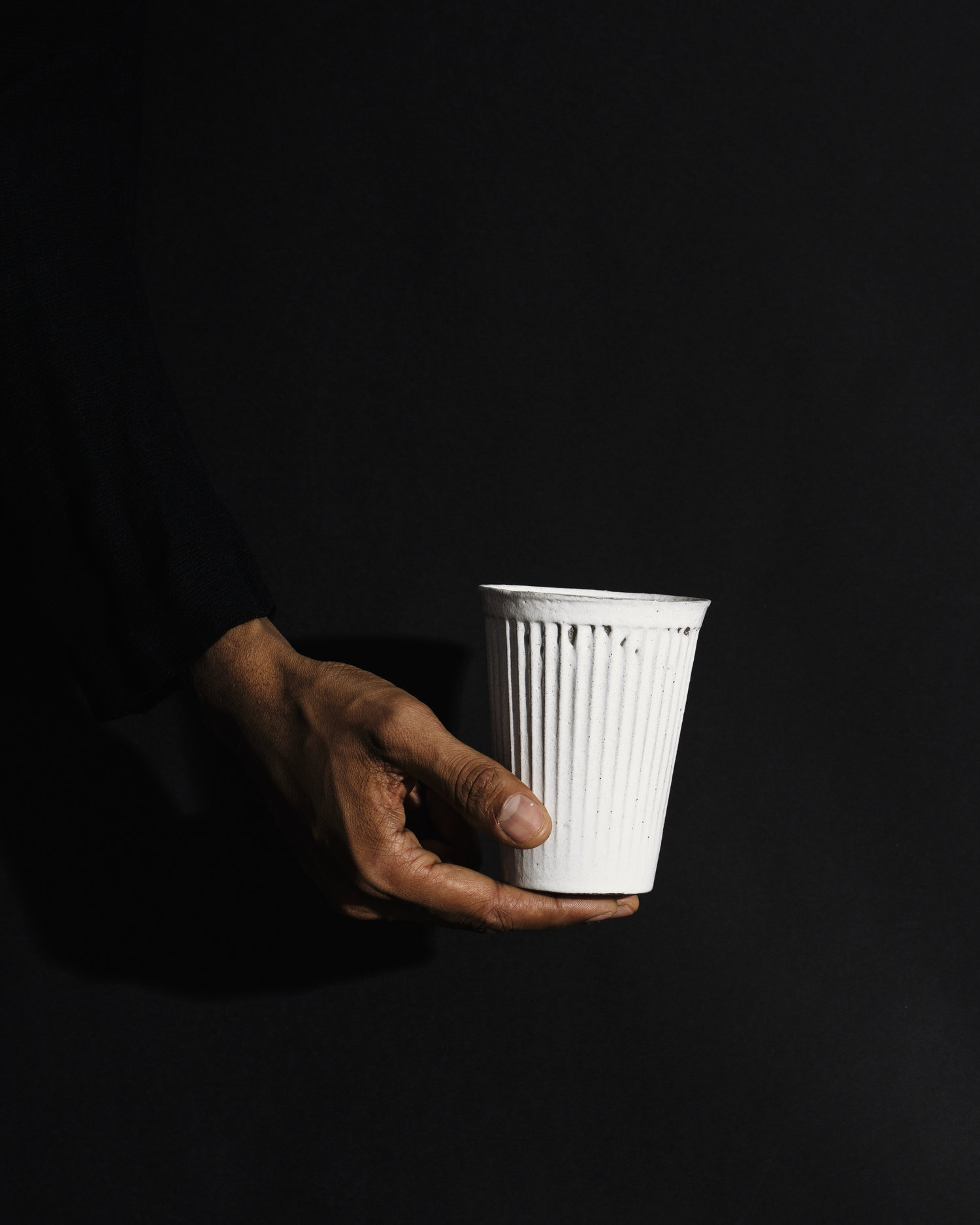 Hand with a cup of coffee