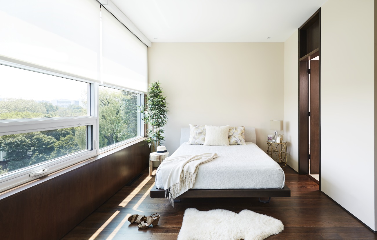 Engineered walnut (from The Floor Shop) runs throughout the third level, including the master bedroom and ensuite. Bed from Palazzetti.