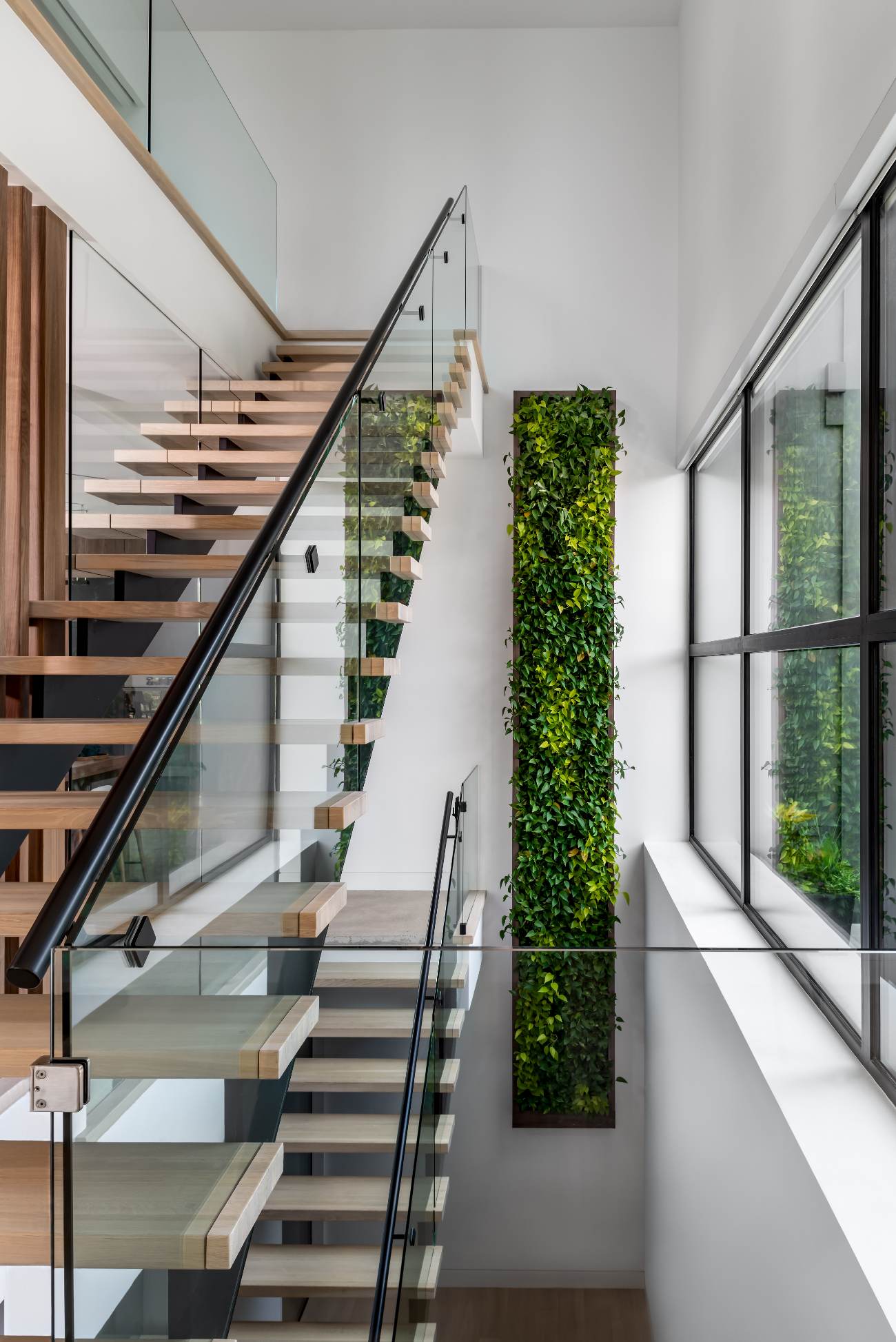 The green wall features its own water management system and – aside from the occasional dead plant – is self-sustaining.