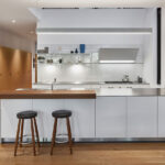 Kitchen with white cabinets Tile house by Kohn Shnier Architects