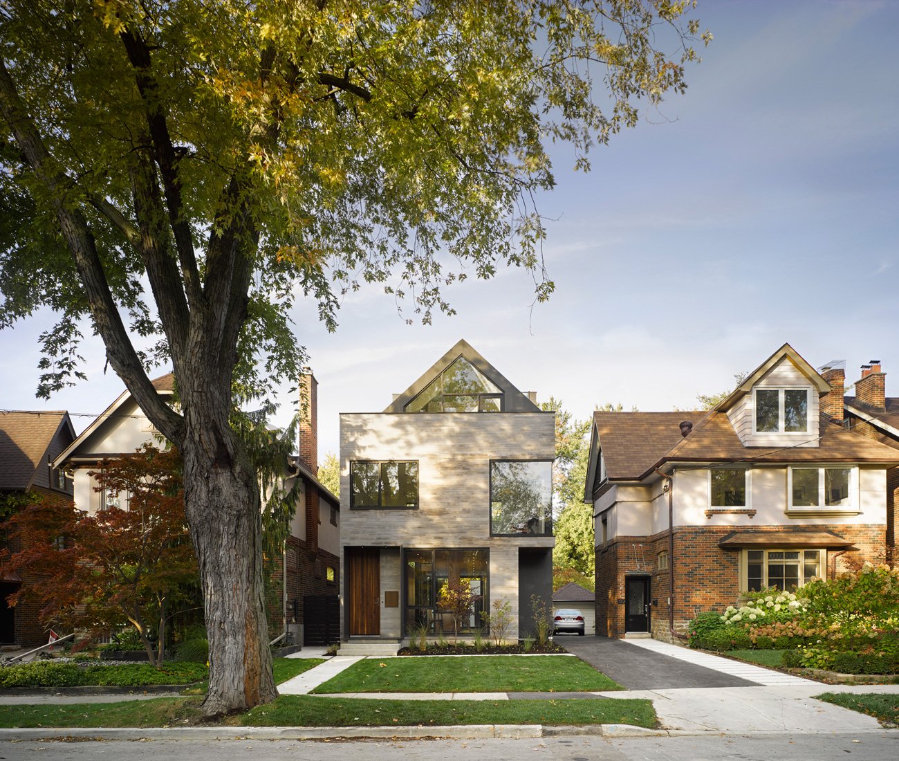 Modern design meets traditional charm with a pitched roof - Drew Mandel Architects home design toronto