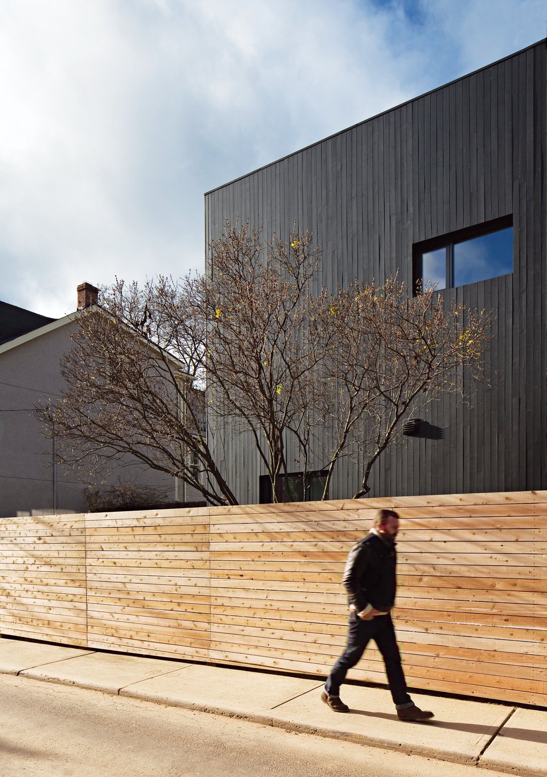 Dubbeldam Summerhill Home cladded in vertical strips of black-stained cedar