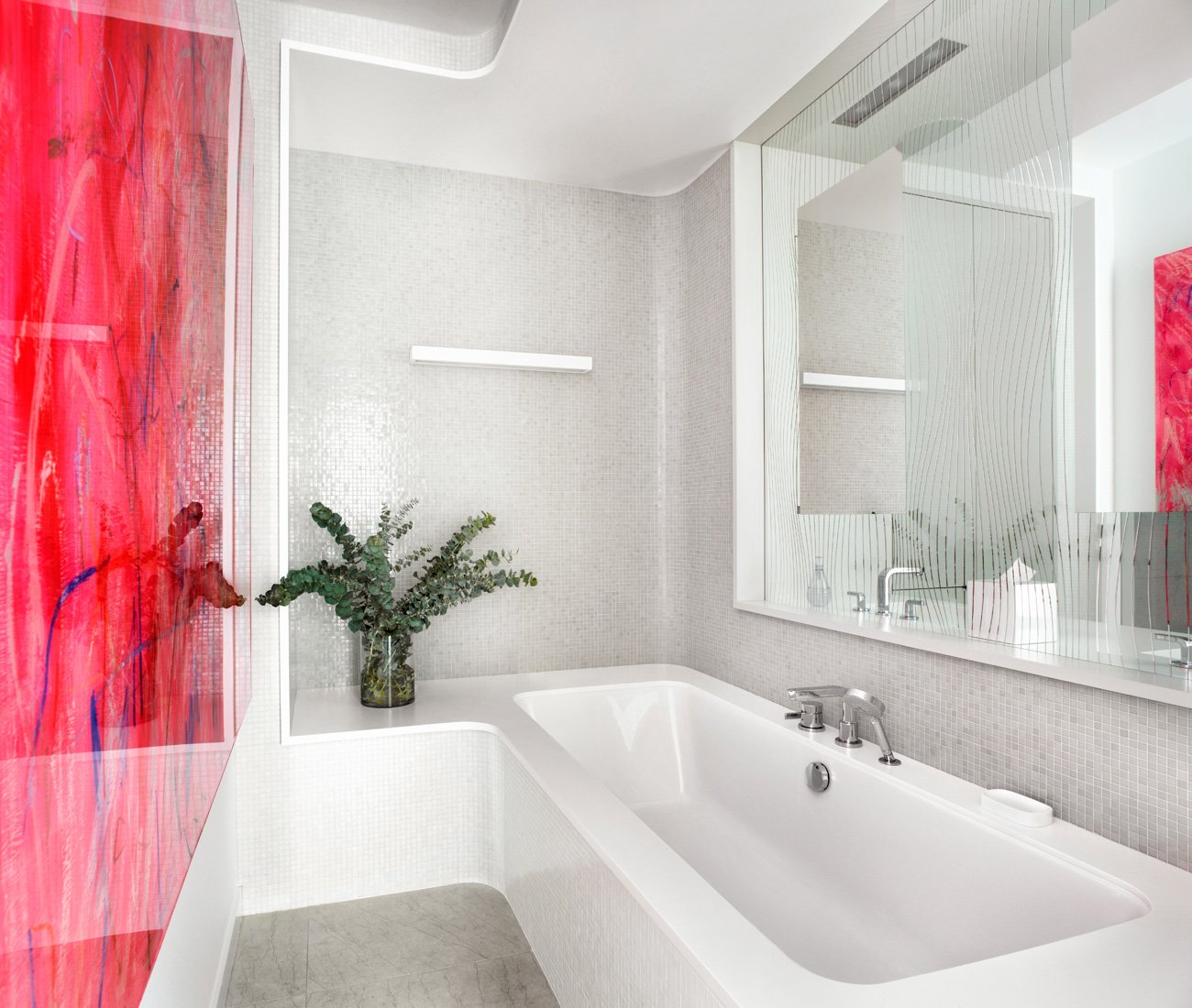 Open Concept Renovation, bathroom with bathtub and see through mirror to the vanity next door.