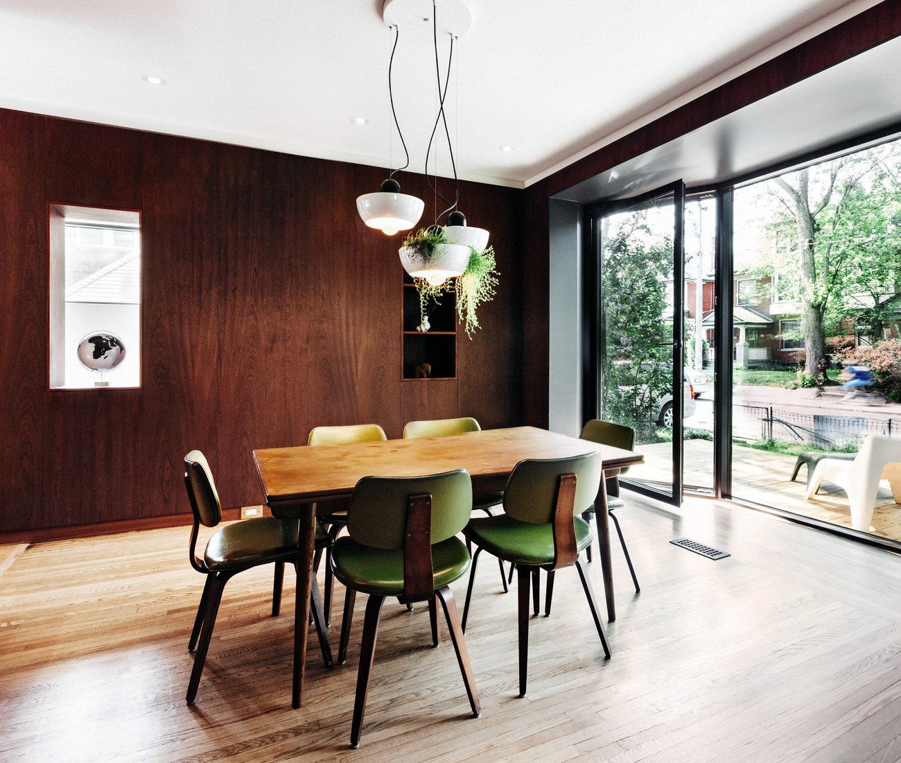 Dining table in a room with bay windows, Renovated Edwardian home