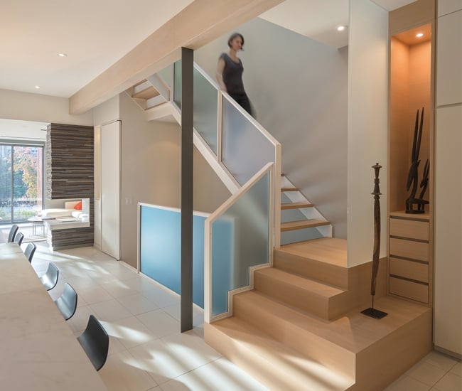 In Through House, custom millwork at the entrance – including a closet, drawers and an illuminated display case – blends into the open-tread staircase. Photo by Bob Gundu. Dubbeldam Architecture Awarded the Prix de Rome