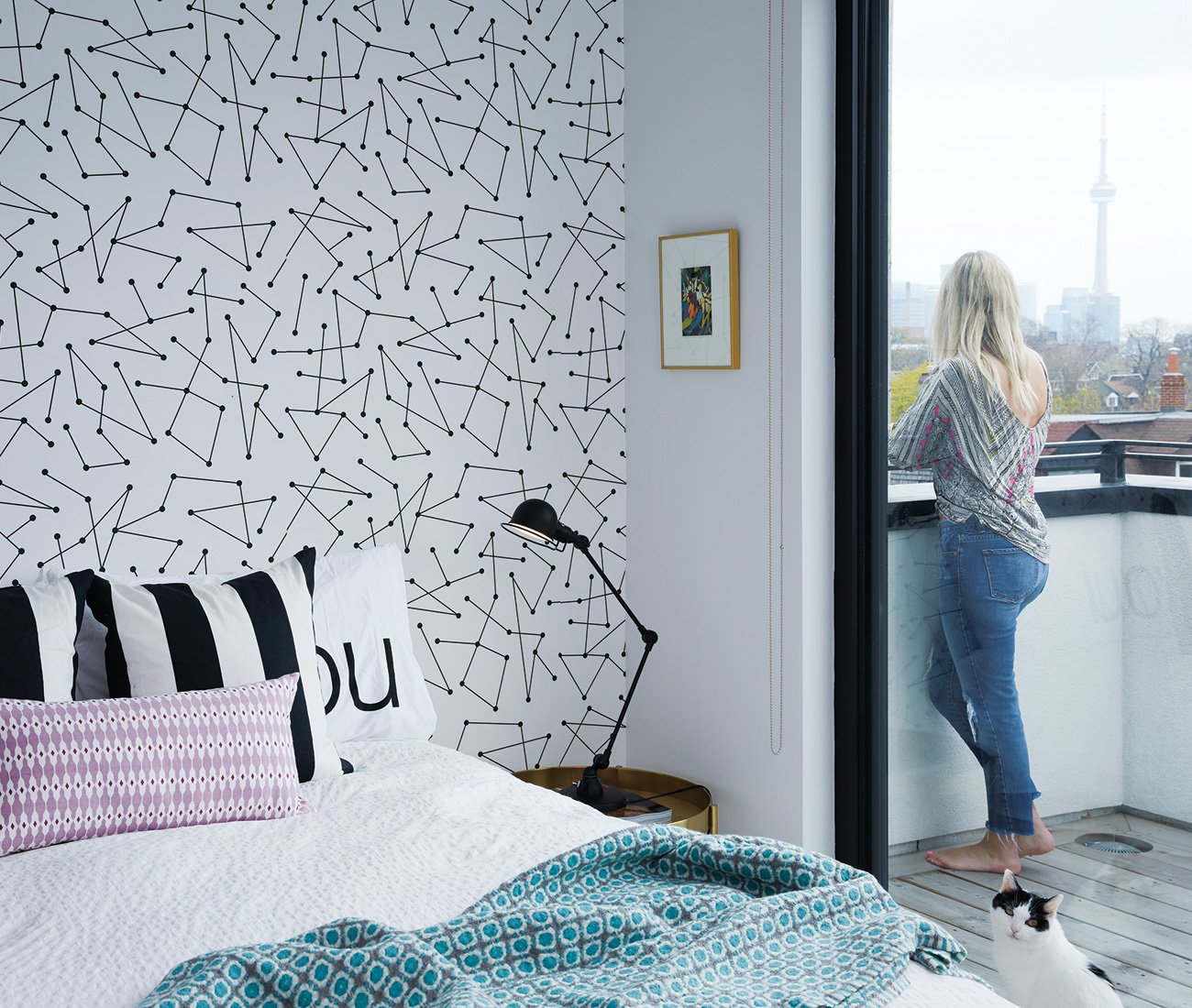 PR professional Kate Makinson enjoys the city view at her Harbord Townhouses designed by Superkül.