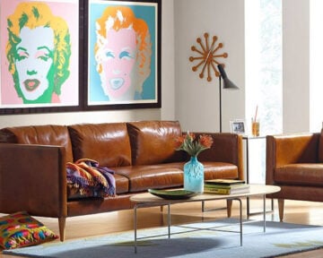 Couch and coffee table with art on the wall from Chesterfield Shop