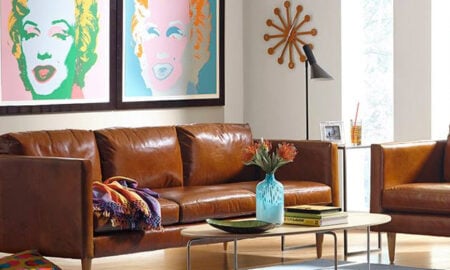 Couch and coffee table with art on the wall from Chesterfield Shop