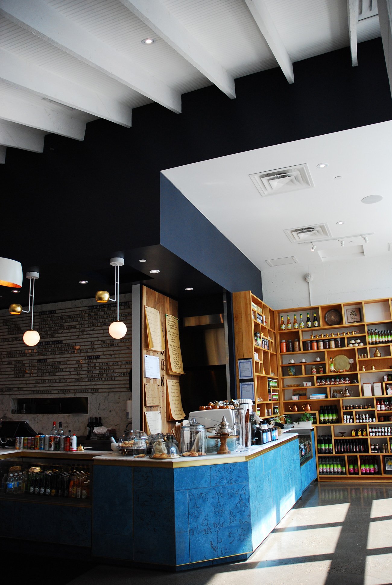 Handwritten menus on brown paper scrolls at Souk Tabule