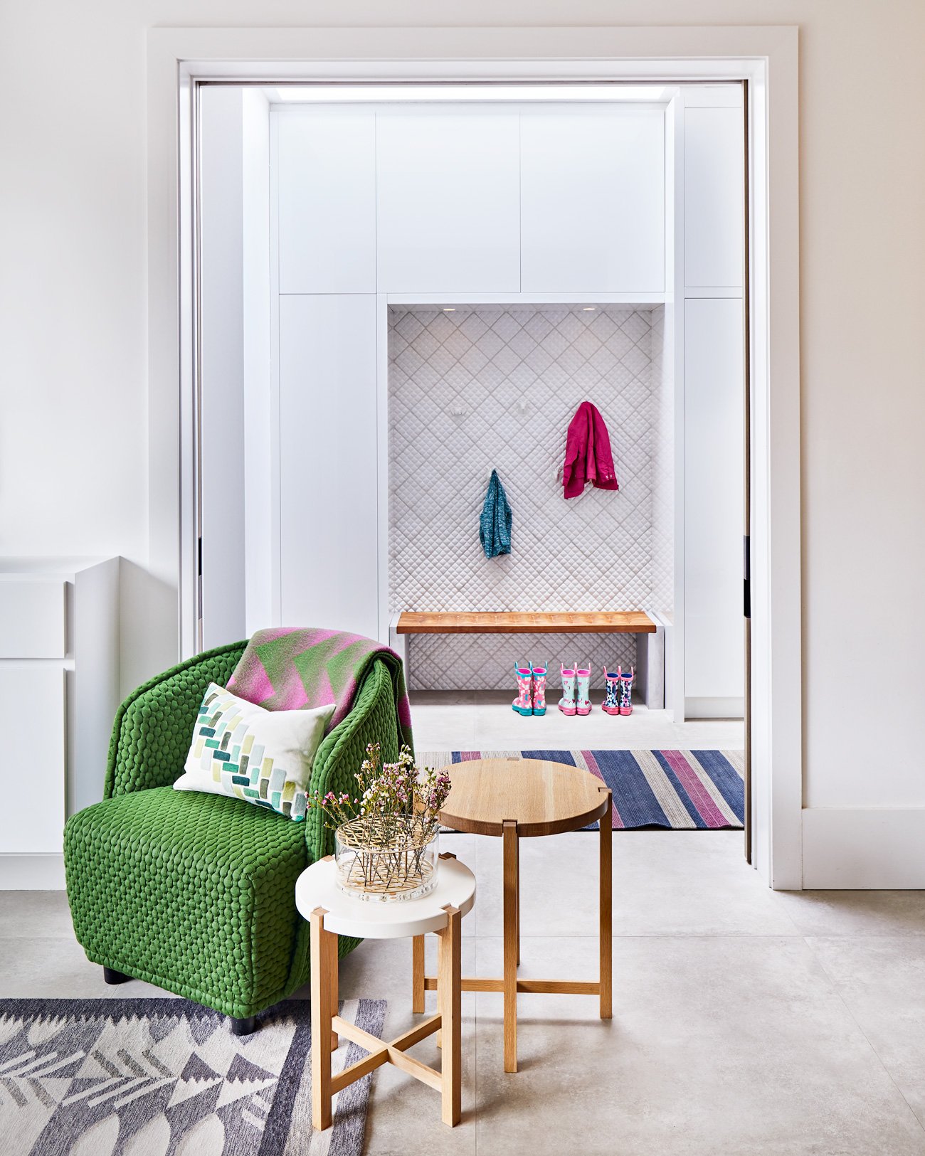 Cabbagetown Victorian Alison Milne Design Toronto Modern Home Tufted green accent chair with round side tables, Quilted ceramic tile by Black Rock Studio and a custom walnut bench