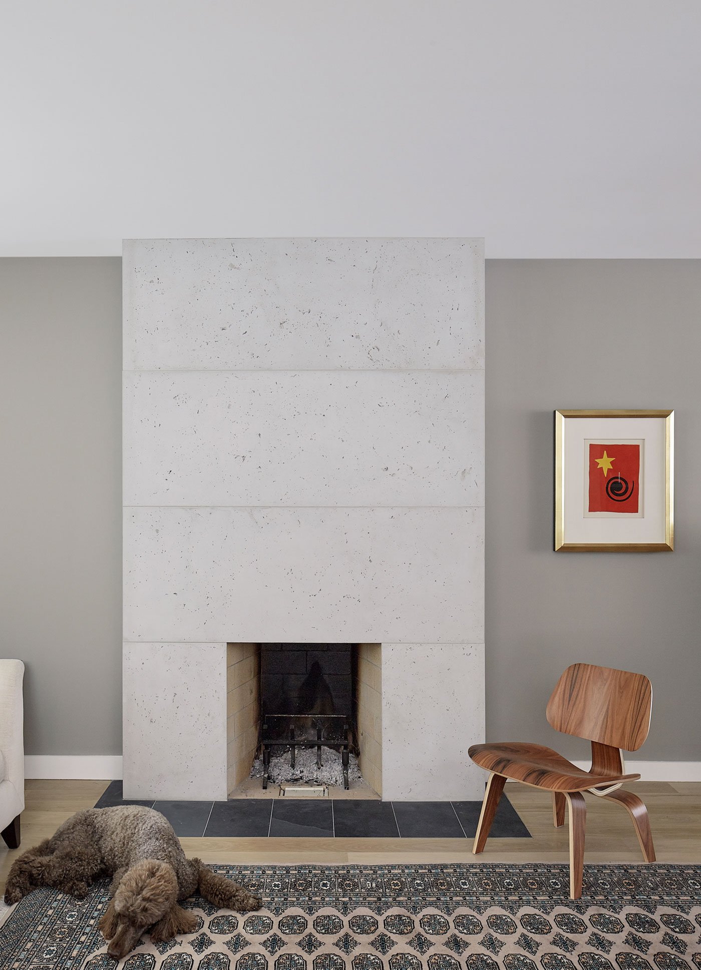 The concrete fireplace in House of Louis
