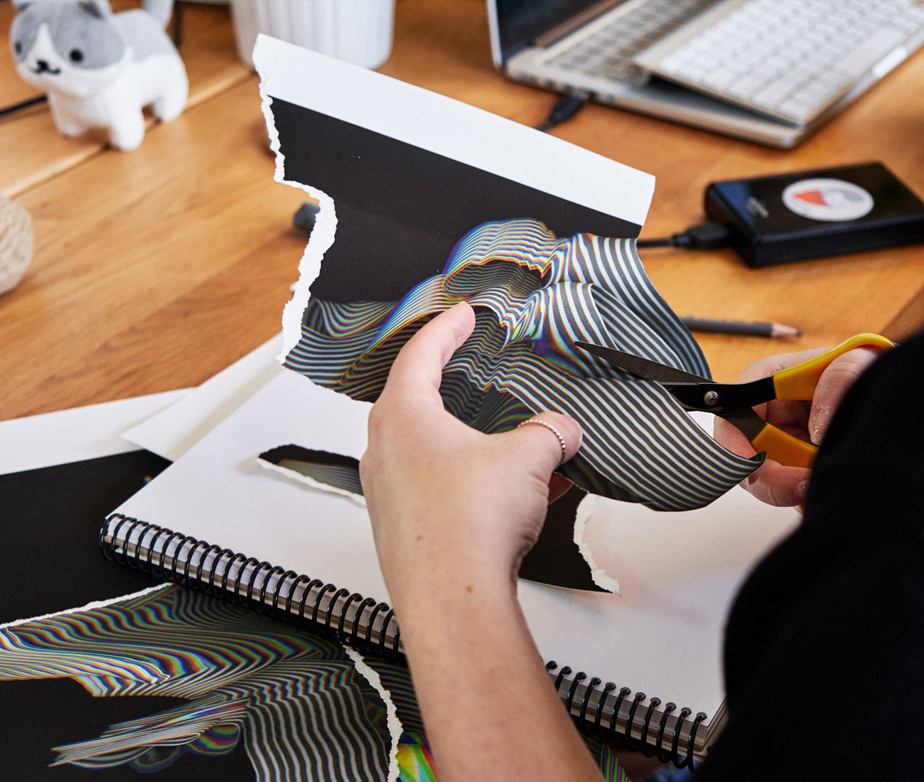 Hands cutting a piece of paper