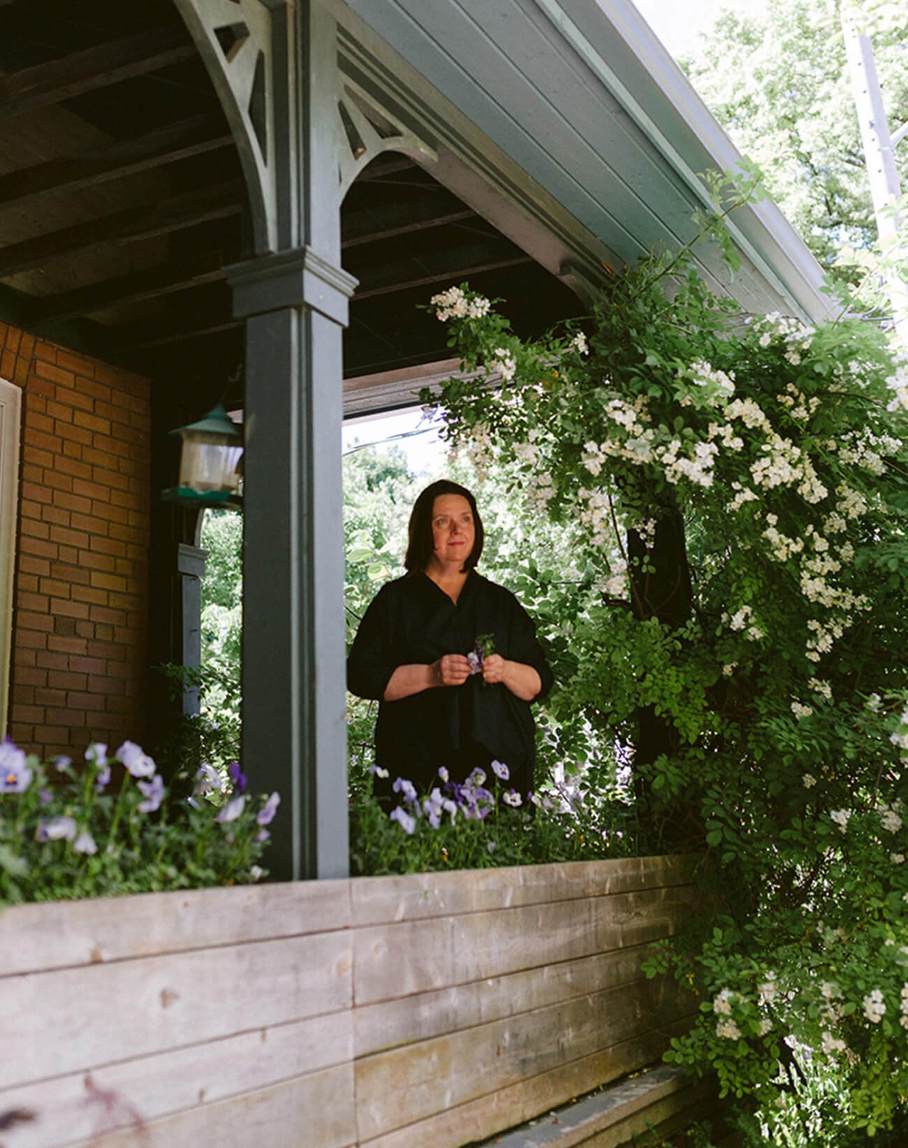Deborah Moss, founder of Moss & Lam, on her house front porch