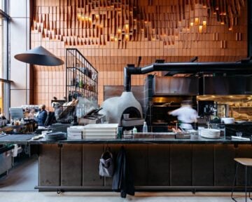 Interior of Gusto 501 restaurant with pizza oven