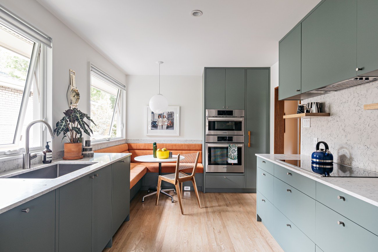 kitchen with green cabinetry by Ben Homes - Burlinghton