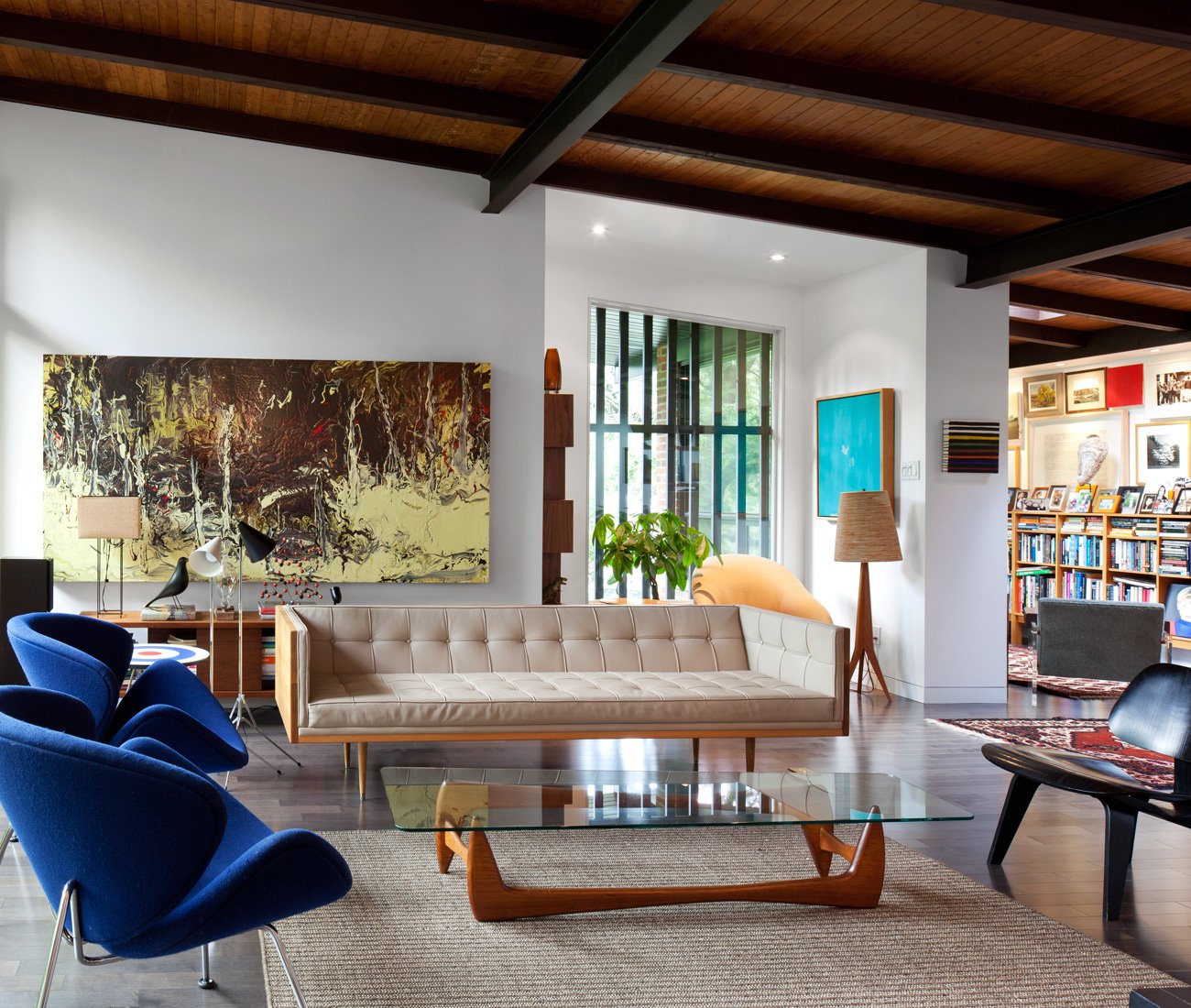 mid-century bungalow renovation, living room layout with sofa and chairs around a coffee table on an area rug