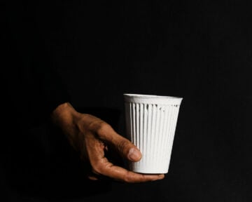 Hand with a cup of coffee