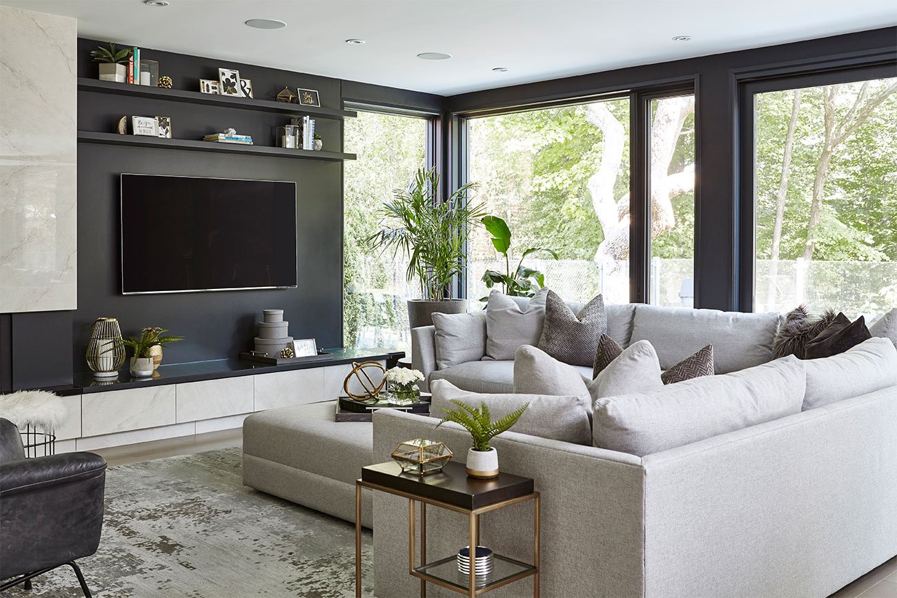 Living room with a section sofa at Leaside residence. Photo by Valerie Wilcox.