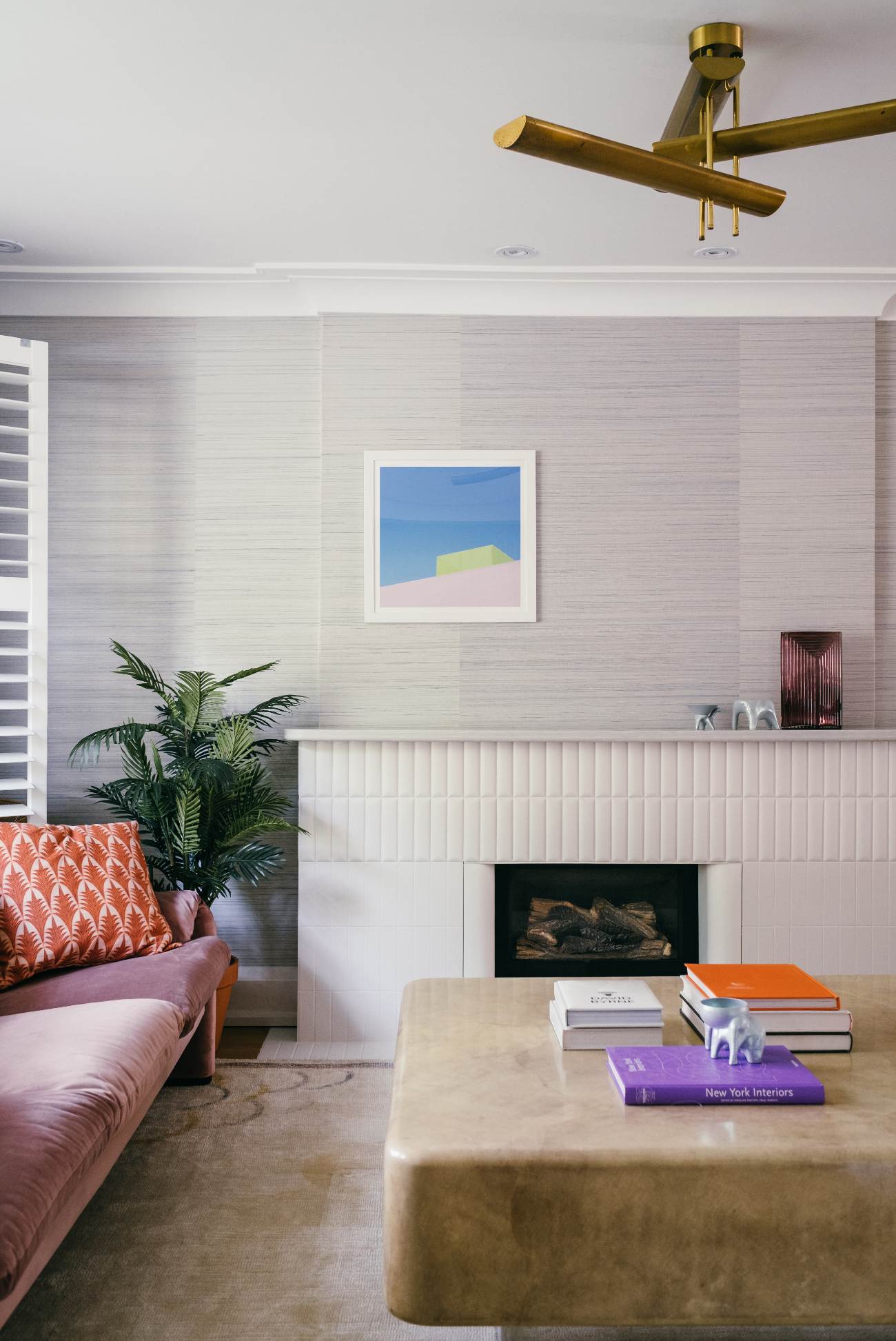 Grasscloth wallpaper by Phillip Jeffries - fireplace re-clad in tiles from 41Zero42's Biscuit collection