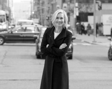 Portrait of urban planner Jennifer Keesmaat standing in the street with her arms crossed