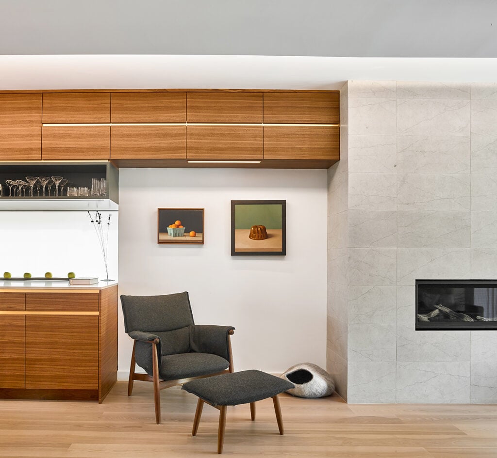 Grey chair marks entrance to the living room 