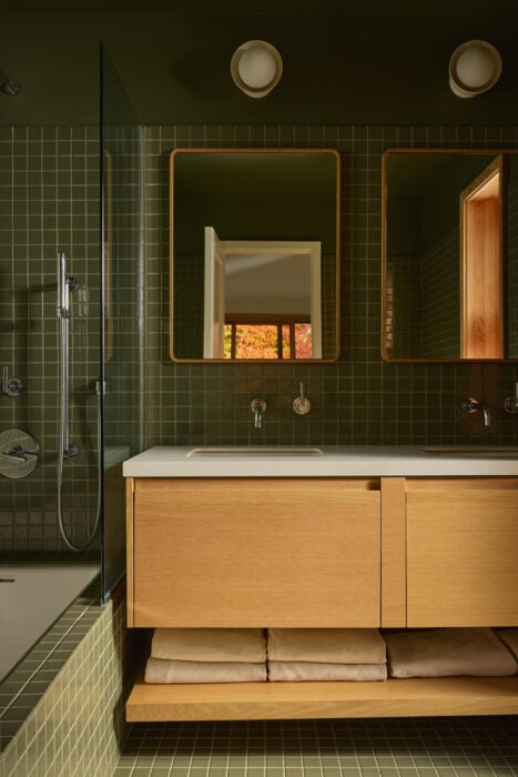 ensuite bathroom with green tile